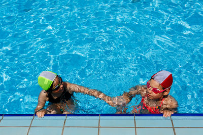 High angle view of woman swimming in pool