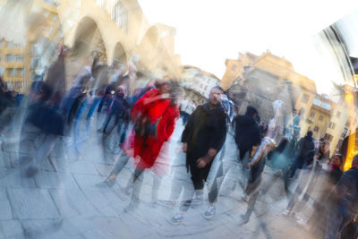 People walking on street in city