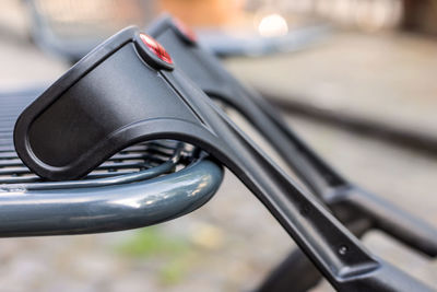 Close-up of camera on railing