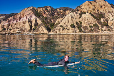 People swimming in sea