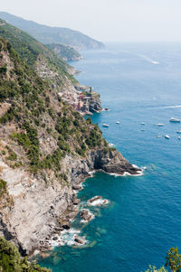 High angle view of scenic sea by mountains