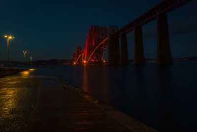 View of suspension bridge at night