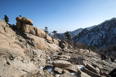 Scenic view of mountains against clear sky during winter