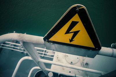 High angle view of high voltage sign on ship