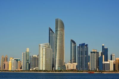 Skyscrapers in city against clear sky