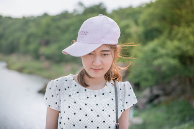Portrait of smiling girl standing outdoors