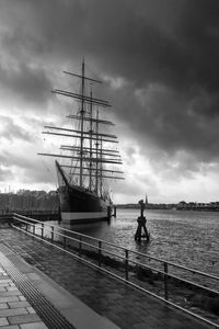 Ship sailing on sea against sky