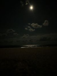 Scenic view of sea against sky at night