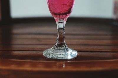 Close-up of wineglass on table