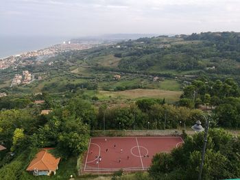 Scenic view of green landscape against sky