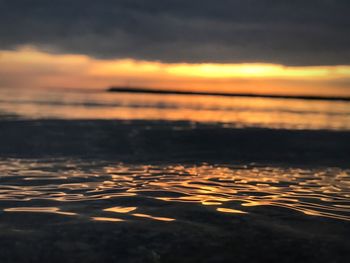 Scenic view of sea against sky at sunset