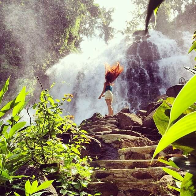 statue, sculpture, plant, motion, tree, leaf, fountain, green color, human representation, art and craft, art, low angle view, water, rock - object, nature, day, outdoors, creativity, full length, long exposure