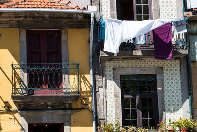 Low angle view of clothes drying outside building