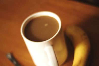 Close-up of coffee cup on table