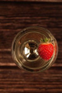 Directly above shot of cherries in glass on table