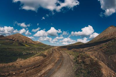 Panoramic view of road amidst mountains against sky