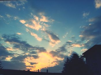Low angle view of built structure at sunset