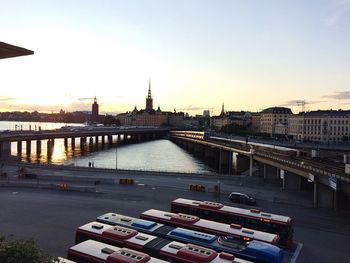 View of bridge over river in city against sky