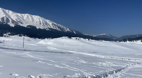 Scenic view of snowcapped mountains against sky