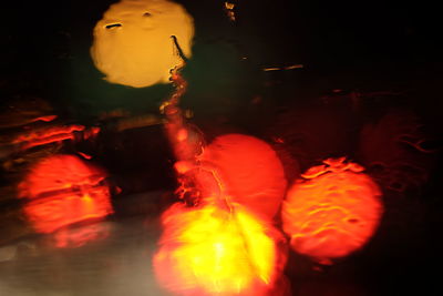 Close-up of illuminated fire in water