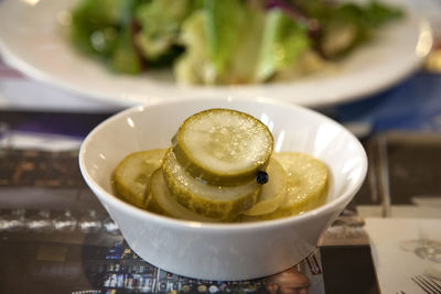 Close-up of sliced cucumber in bowl on table