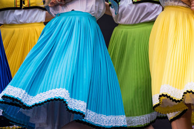 Midsection of dancers performing outdoors