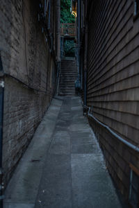 Empty alley amidst buildings