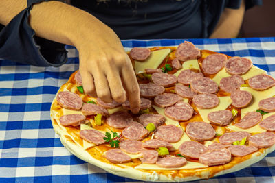 Close-up of man preparing food on table