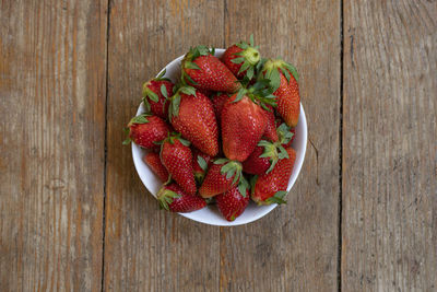 High angle view of strawberries in bowl on table