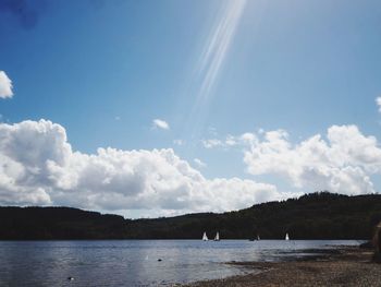 Scenic view of sea against blue sky