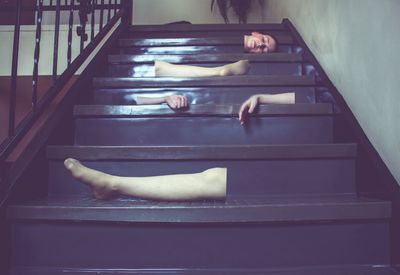 Close-up of cat relaxing on table at home