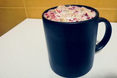 Close-up of coffee cup on table