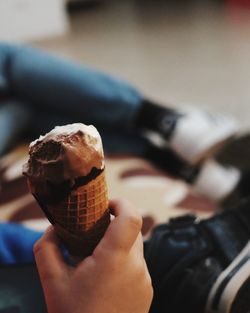 Close-up of hand holding ice cream