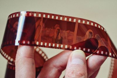 Close-up of human hand against gray background