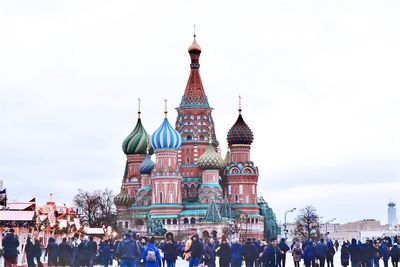 Group of people in front of building against sky