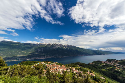 Scenic view of sea and mountains against sky