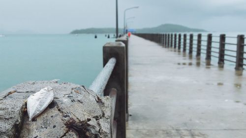 Pier over sea against sky