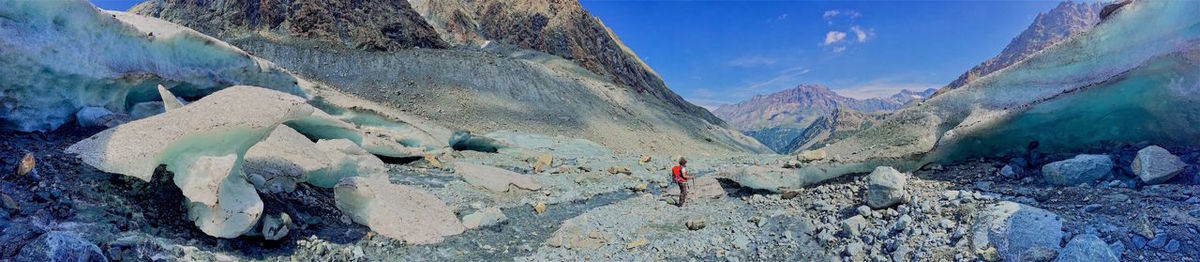 Tilt image of person on rock against sky