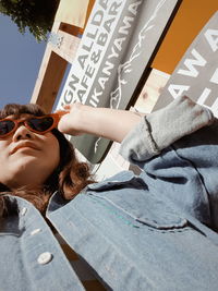Low angle view of woman wearing sunglasses
