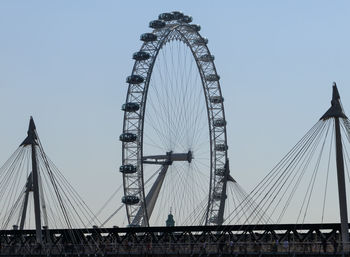 Low angle view of ferris wheel against sky