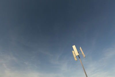 Wind turbine horizontal axis turbine generate electricity on background of blue sky.copy space