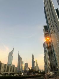 Modern buildings in city against sky