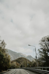 Empty road against sky