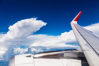 Low angle view of airplane flying in sky