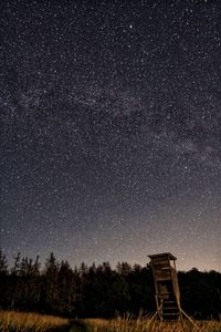 Scenic view of field against sky at night