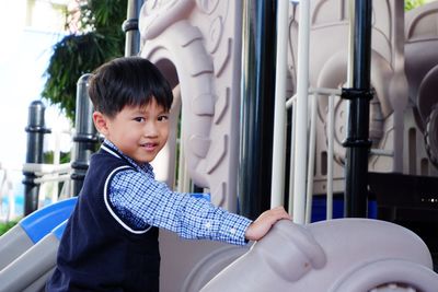 Portrait of boy smiling in playground