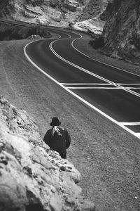 High angle view of woman walking on road