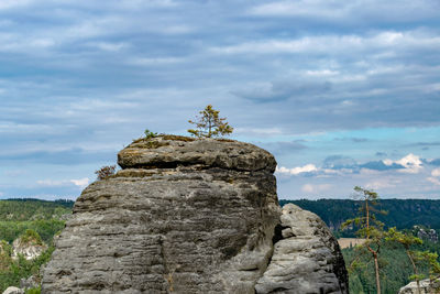 Rock formation on mountain against sky