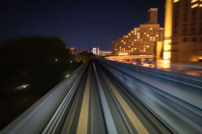 High angle view of light trails on road at night