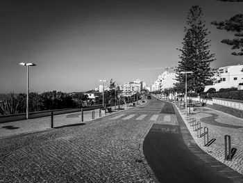 Street amidst buildings against sky